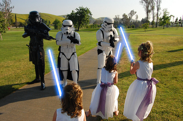 Flower girls fighting storm troopers with light sabers